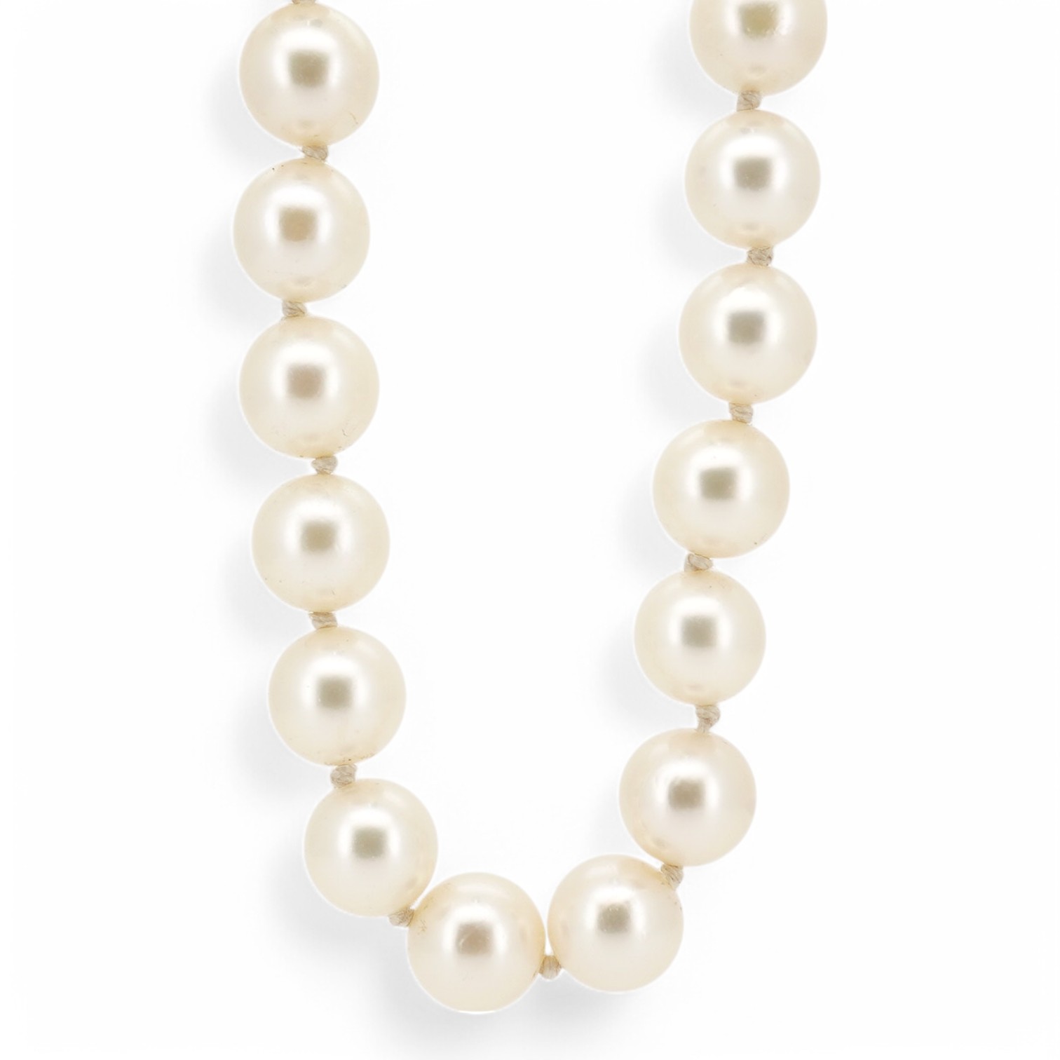 A single strand cultured pearl necklace by Mikimoto, with signed 14k and cultured pearl set clasp, 50cm. Condition - good